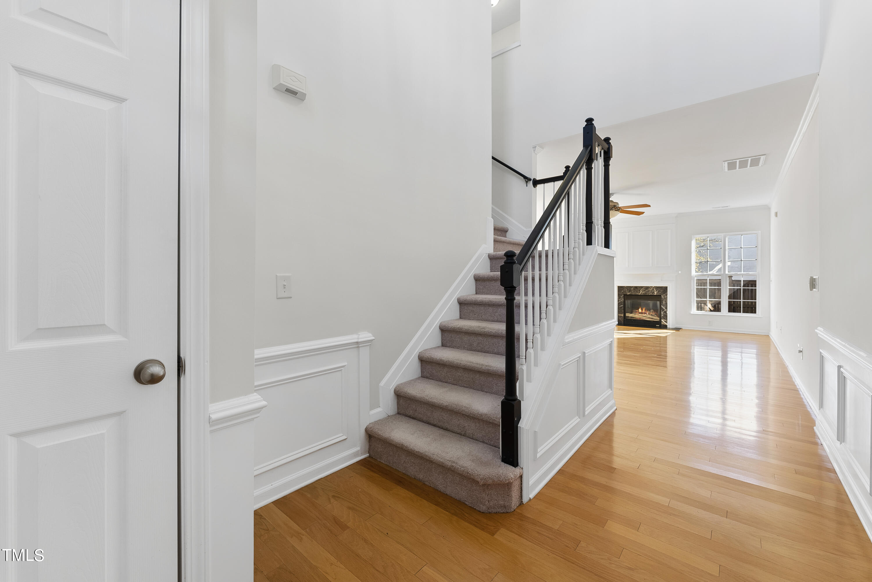 7717 Tanby Court Raleigh, NC 27613 - Photo 4 of 33 a view of entryway and hall with wooden floor