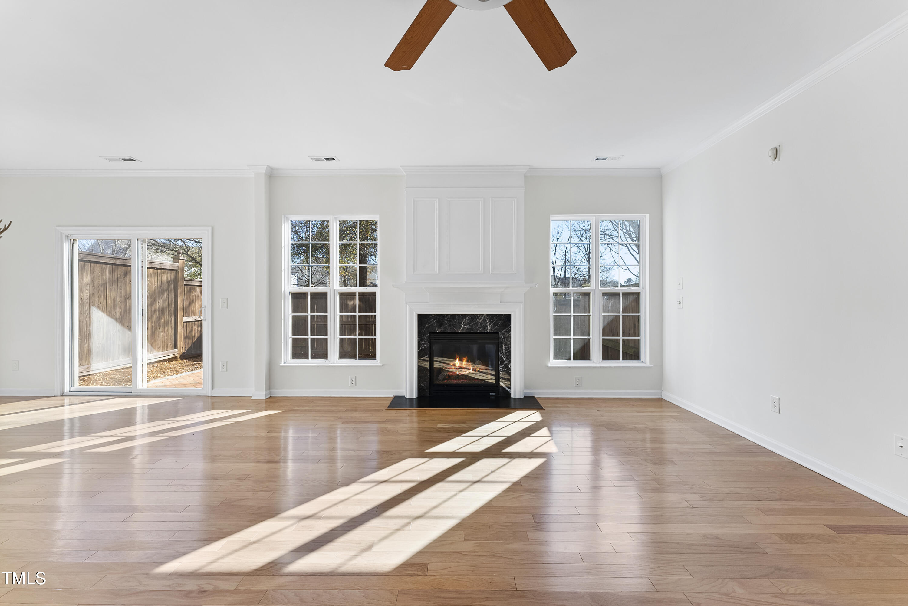 7717 Tanby Court Raleigh, NC 27613 - Photo 7 of 33 a living room with furniture and a fireplace