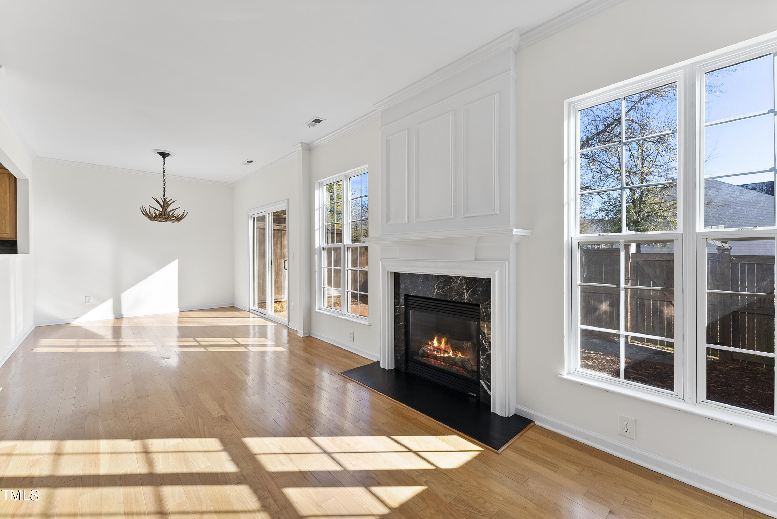 7717 Tanby Court Raleigh, NC 27613 - Photo 8 of 33 a living room with furniture and a fireplace