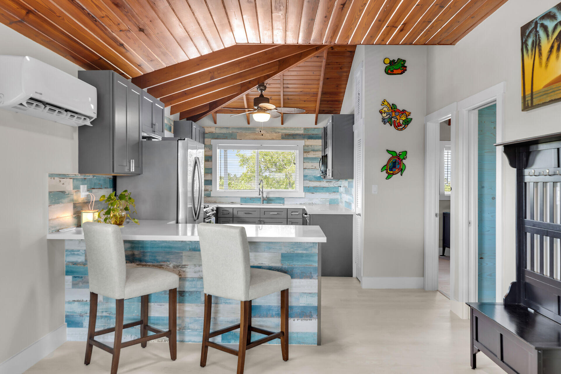 3231 Pompano Street Big Pine Key, FL 33043 - Photo 21 of 42 a dining room with furniture and a window