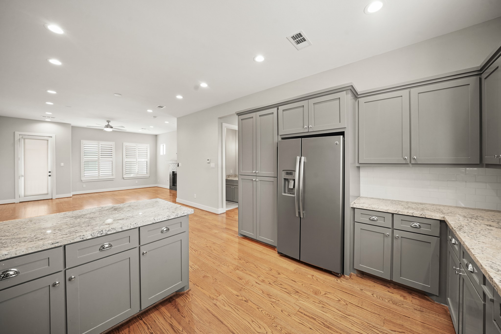 2547 Calumet Street Houston, TX 77004 - Photo 12 of 28 a kitchen with stainless steel appliances granite countertop a refrigerator and a sink