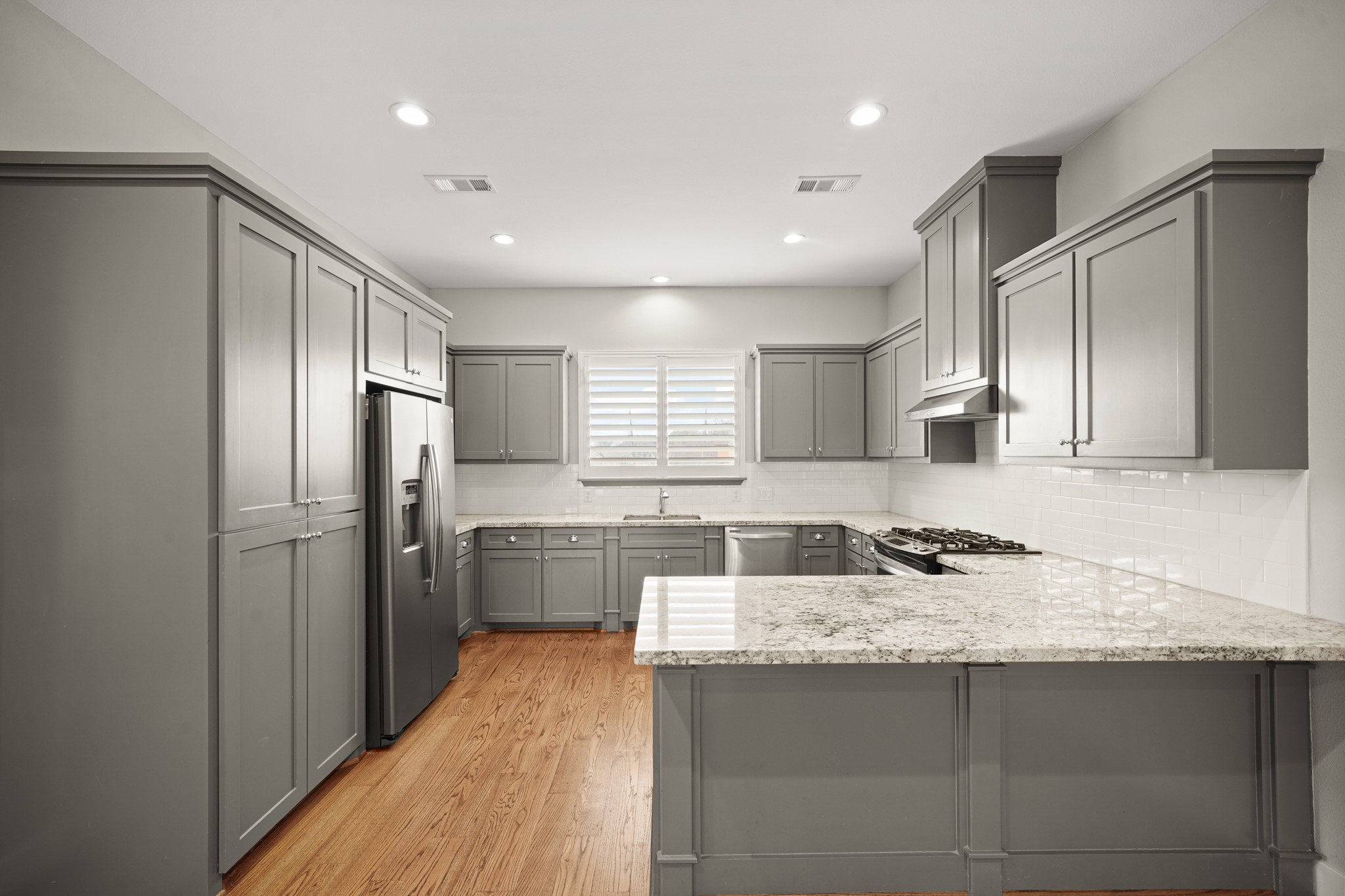 2547 Calumet Street Houston, TX 77004 - Photo 15 of 28 a kitchen with stainless steel appliances granite countertop a sink stove and refrigerator