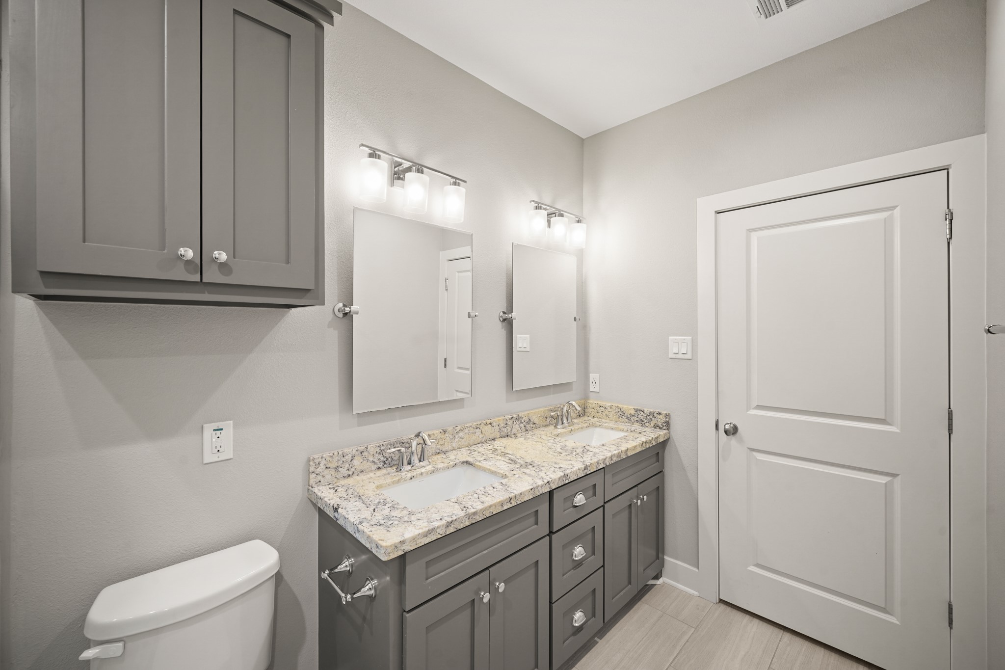 2547 Calumet Street Houston, TX 77004 - Photo 21 of 28 a bathroom with a granite countertop sink and a mirror