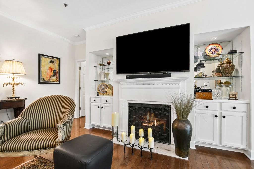 2921 Lenox Road Northeast, Unit 103 Atlanta, GA 30324 - Photo 6 of 37 a living room with furniture and a flat screen tv