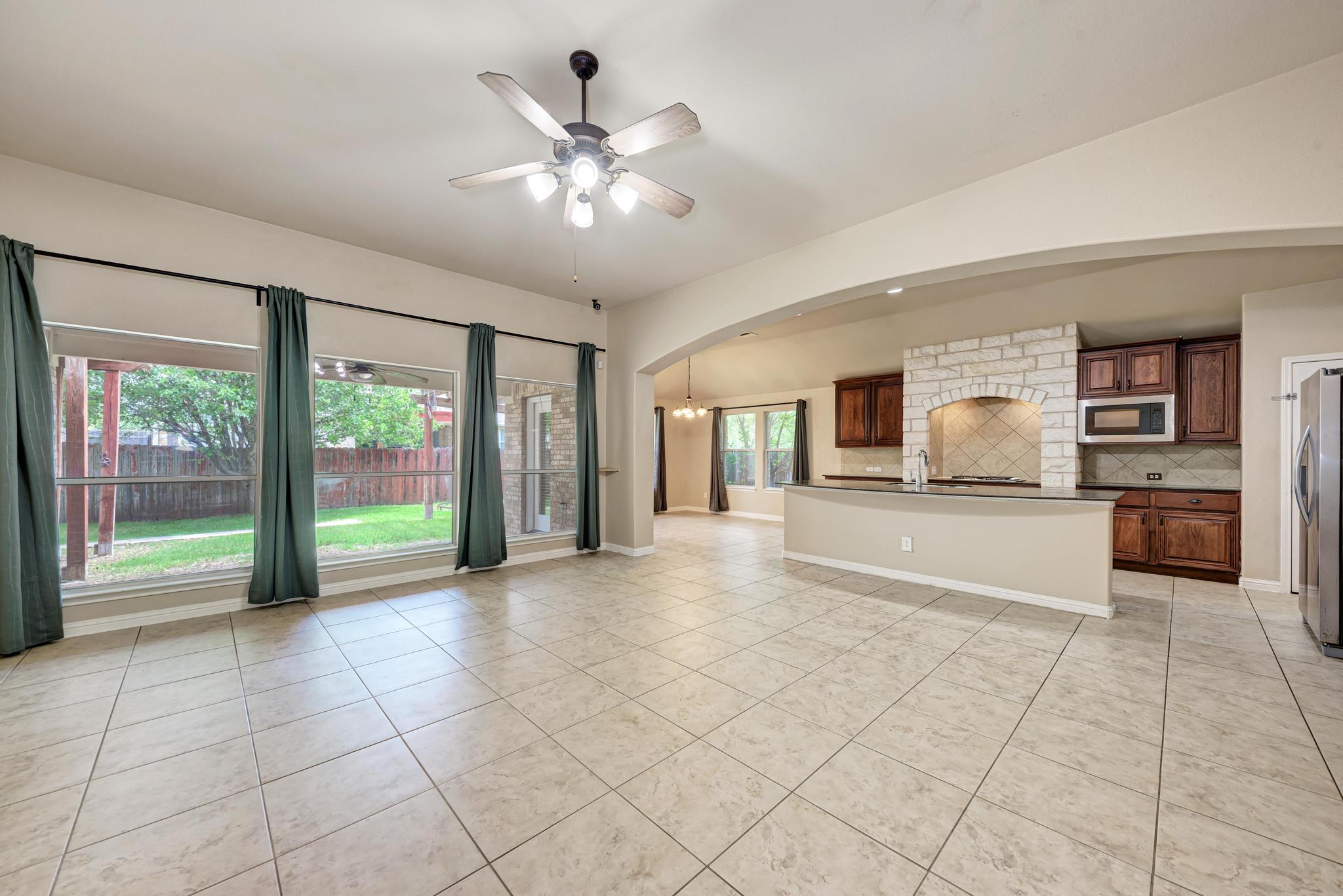 18308 Shallow Pool Drive Pflugerville, TX 78660 - Photo 10 of 40 Open concept, natural light and views of the backyard.