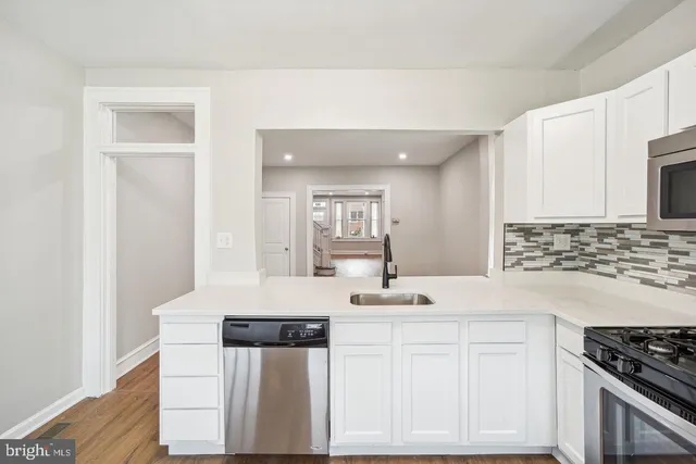 a bathroom with a toilet sink shower and mirror