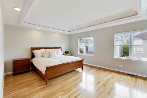 a spacious bedroom with a bed and window