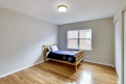 a room with a bed and window