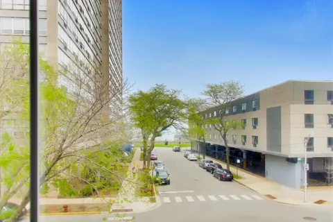 a view of a building with a tree