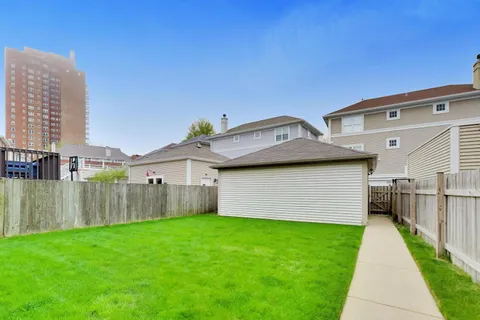 a front view of house with yard and outdoor seating