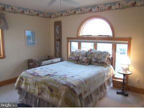 3 Harbor Point Lewes, DE 19958 - Photo 8 of 12 a bedroom with a bed and a window