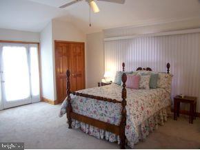 3 Harbor Point Lewes, DE 19958 - Photo 10 of 12 a bedroom with a bed and a window