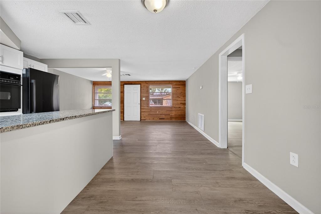 1012 Prescott Lane Holiday, FL 34691 - Photo 12 of 45 a view of gallery with wooden floor