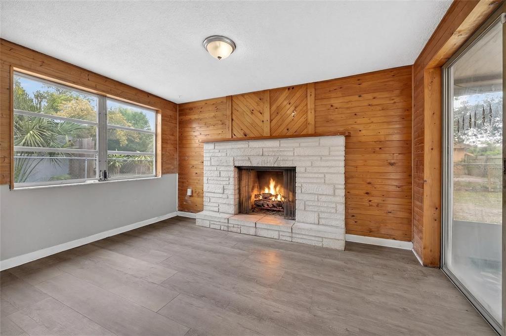 1012 Prescott Lane Holiday, FL 34691 - Photo 32 of 45 an empty room with a fireplace and window