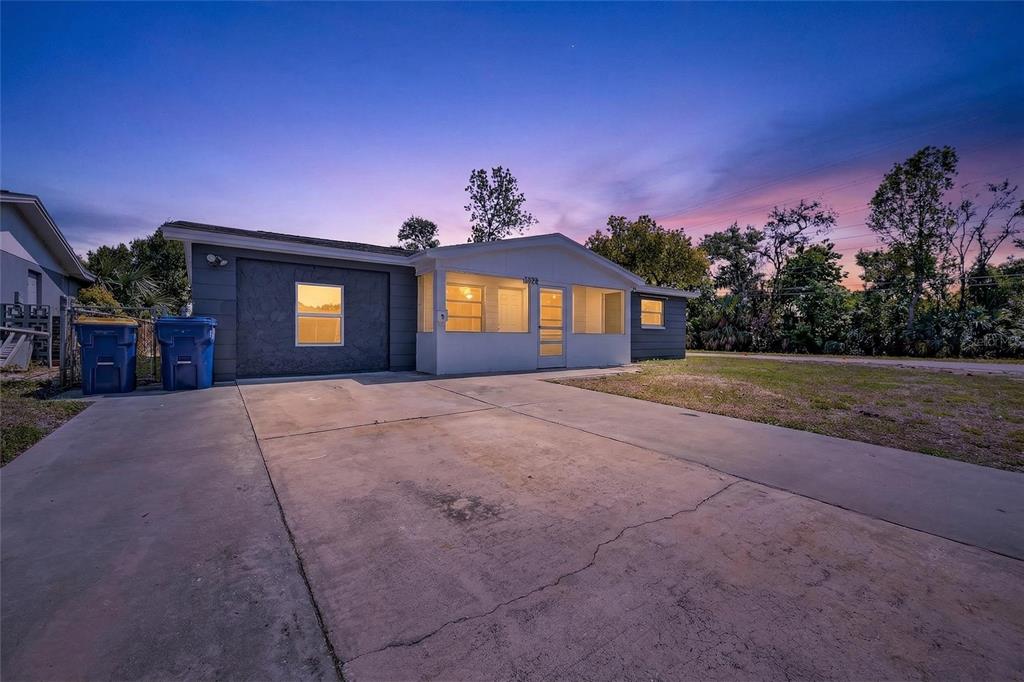 1012 Prescott Lane Holiday, FL 34691 - Photo 4 of 45 a front view of a house with a yard