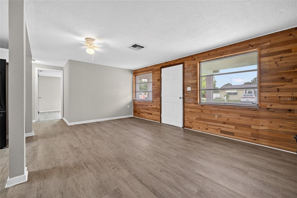 1012 Prescott Lane Holiday, FL 34691 - Photo 6 of 45 wooden floor in an empty room with a window