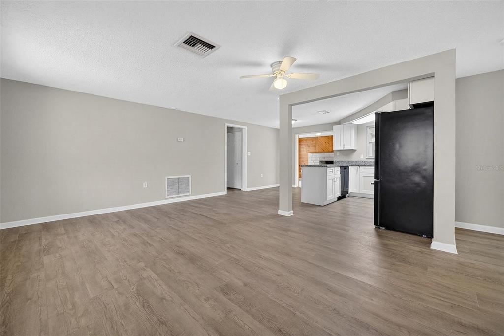 1012 Prescott Lane Holiday, FL 34691 - Photo 10 of 45 a view of empty room with wooden floor and window