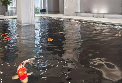 a very nice looking room with gym equipment and large windows