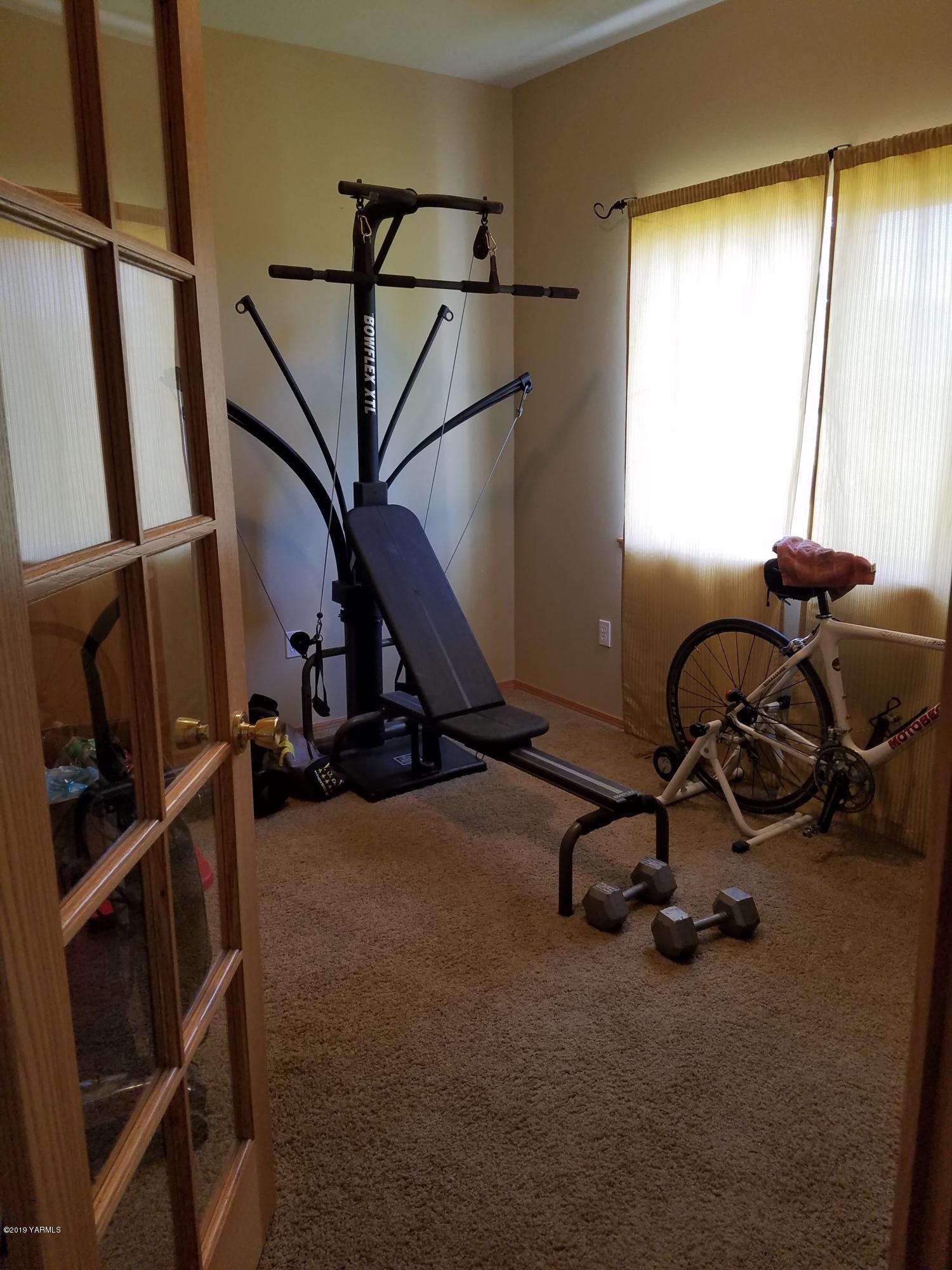 461 Puterbaugh Road Grandview, WA 98930 - Photo 13 of 27 a view of a room with gym equipment