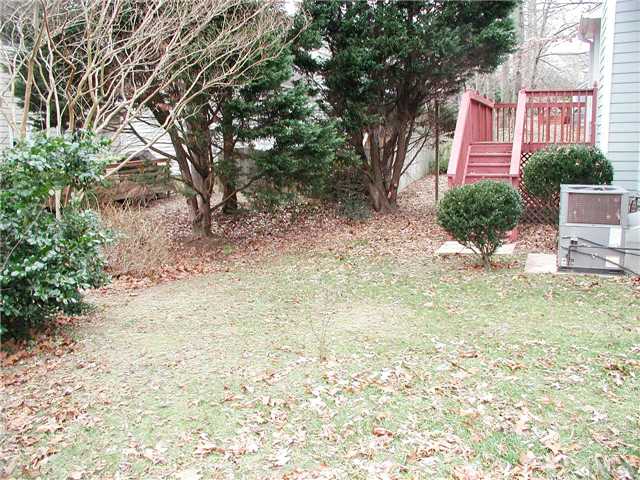 2324 Florida Court Raleigh, NC 27615 - Photo 16 of 17 a view of a house with a yard