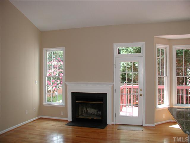 2324 Florida Court Raleigh, NC 27615 - Photo 5 of 17 a living room with a fireplace and a window