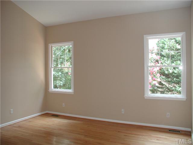 2324 Florida Court Raleigh, NC 27615 - Photo 9 of 17 an empty room with wooden floor and windows