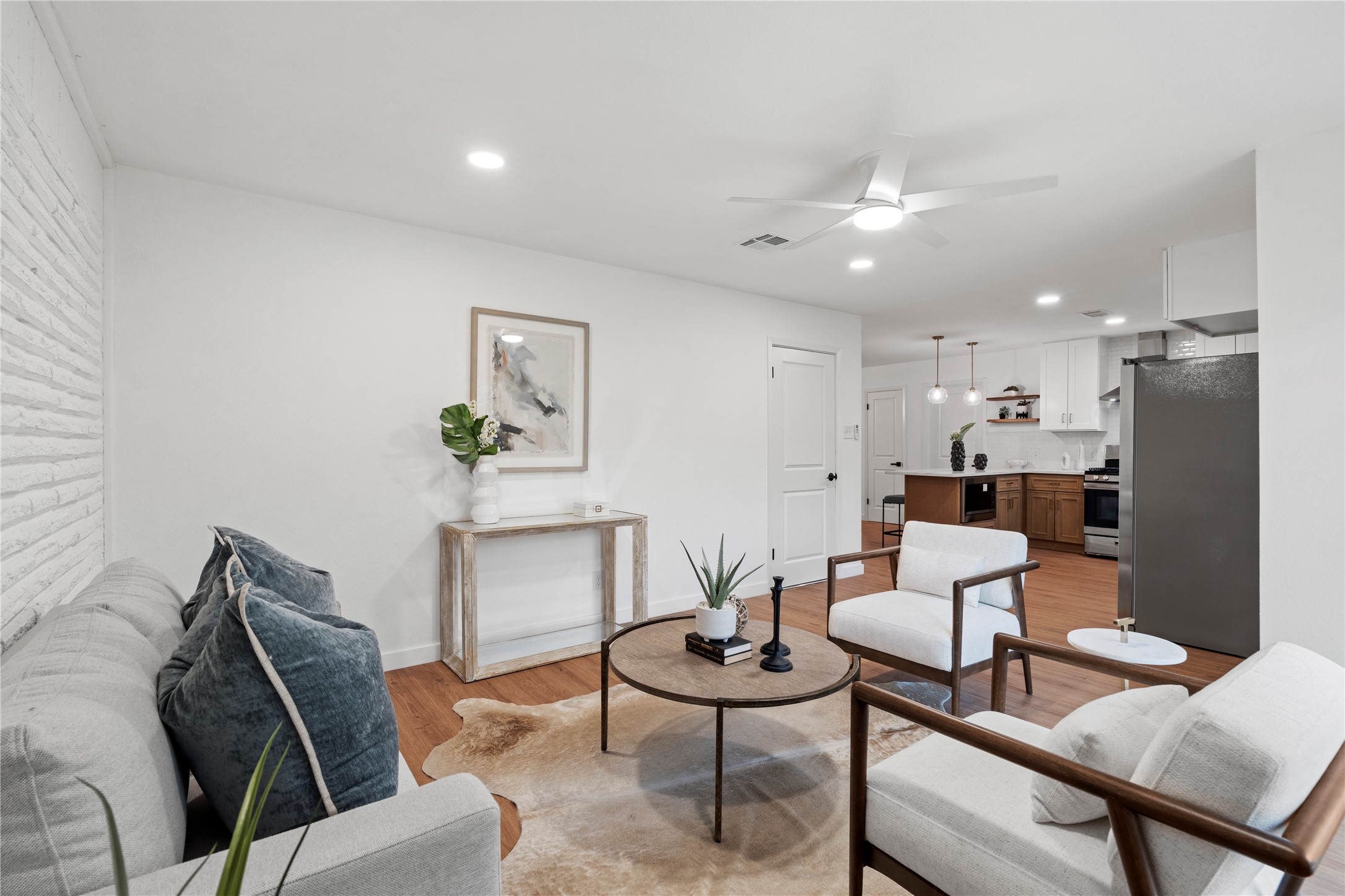 5023 Redstart Street Houston, TX 77035 - Photo 20 of 34 The expansive view from the sunroom highlights the home's effortless flow, connecting peaceful relaxation areas directly to the heart of the kitchen and dining spaces.