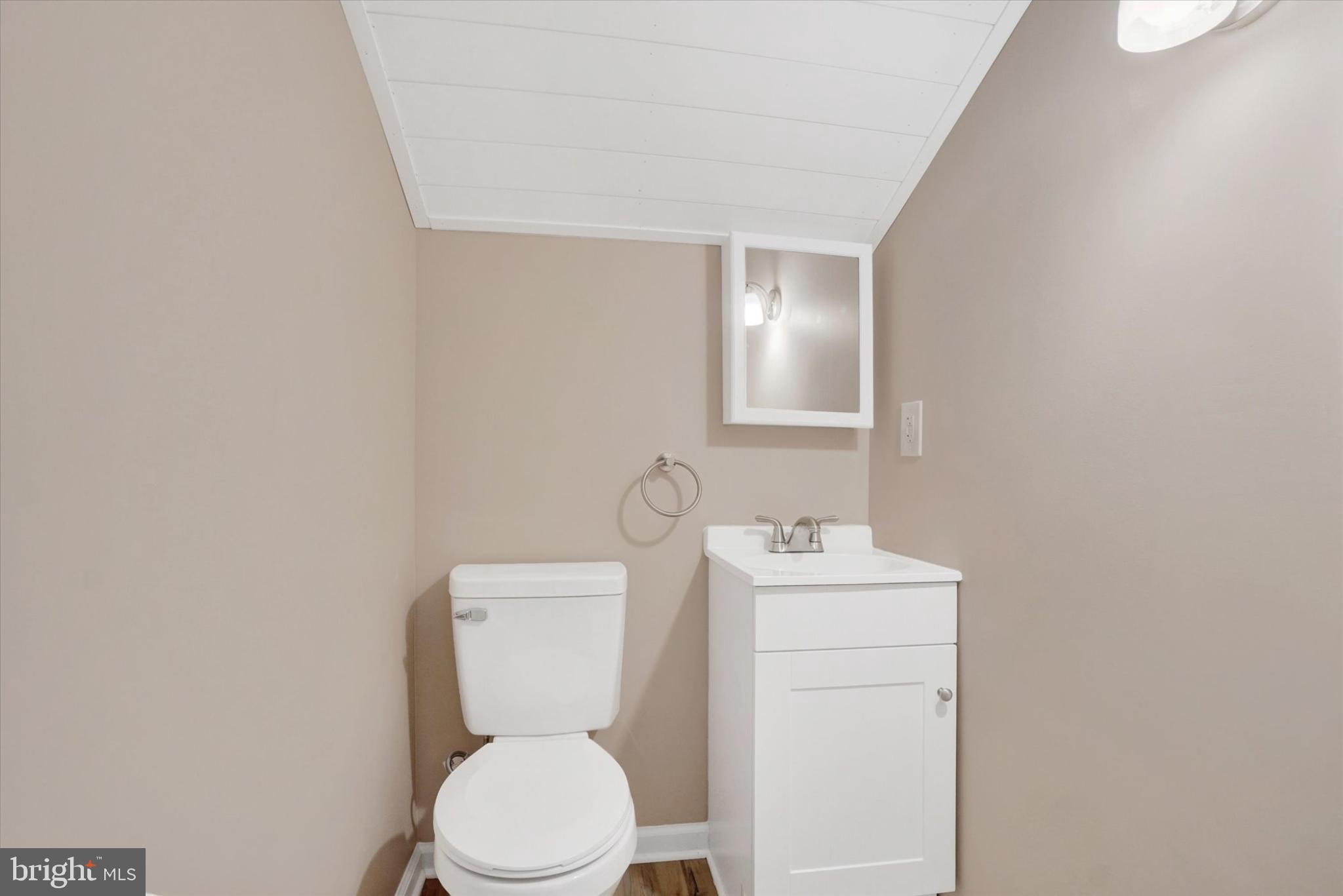 1212 Livingstone Road York, PA 17404 - Photo 18 of 24 a white toilet sitting next to a bathroom sink