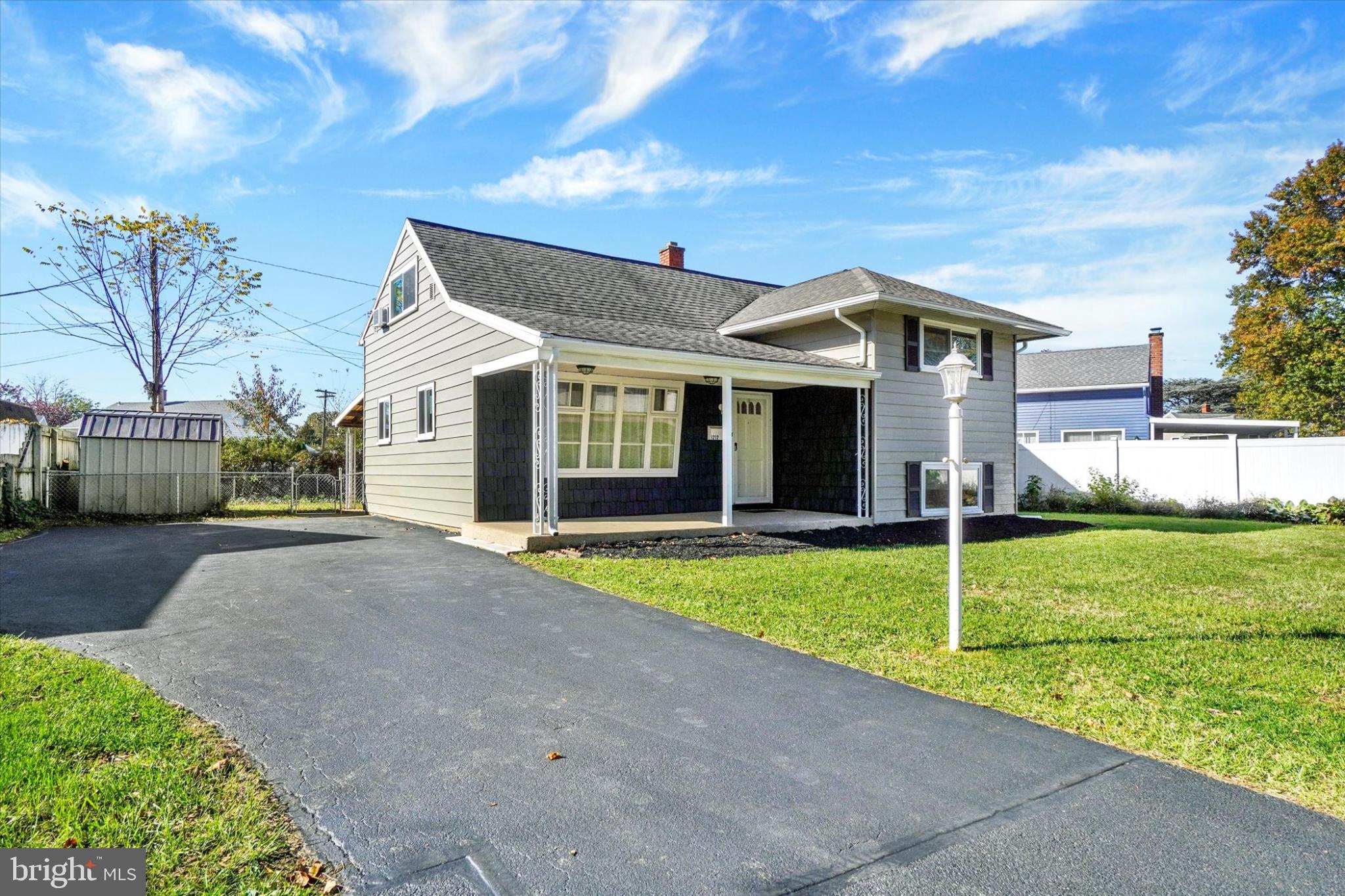1212 Livingstone Road York, PA 17404 - Photo 2 of 24 a front view of a house with a yard