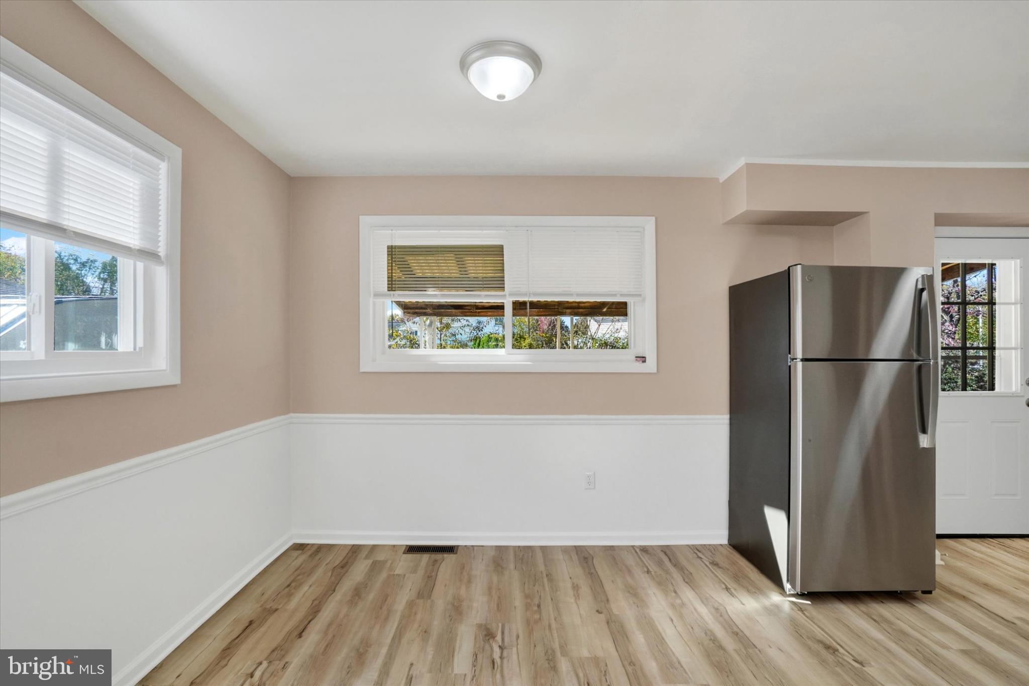 1212 Livingstone Road York, PA 17404 - Photo 22 of 24 a view of a refrigerator in kitchen and wooden floor