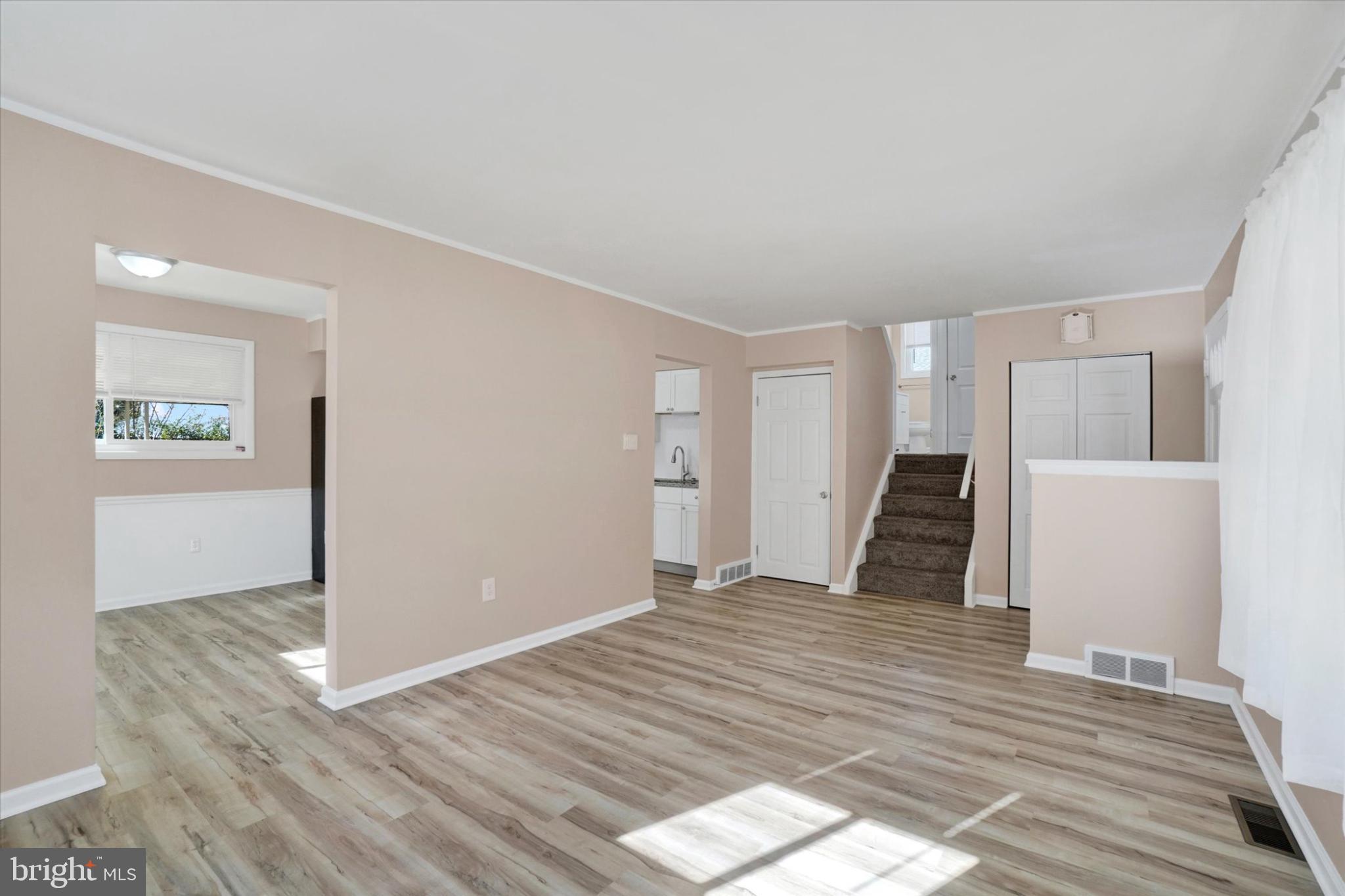 1212 Livingstone Road York, PA 17404 - Photo 3 of 24 an empty room with wooden floor and windows