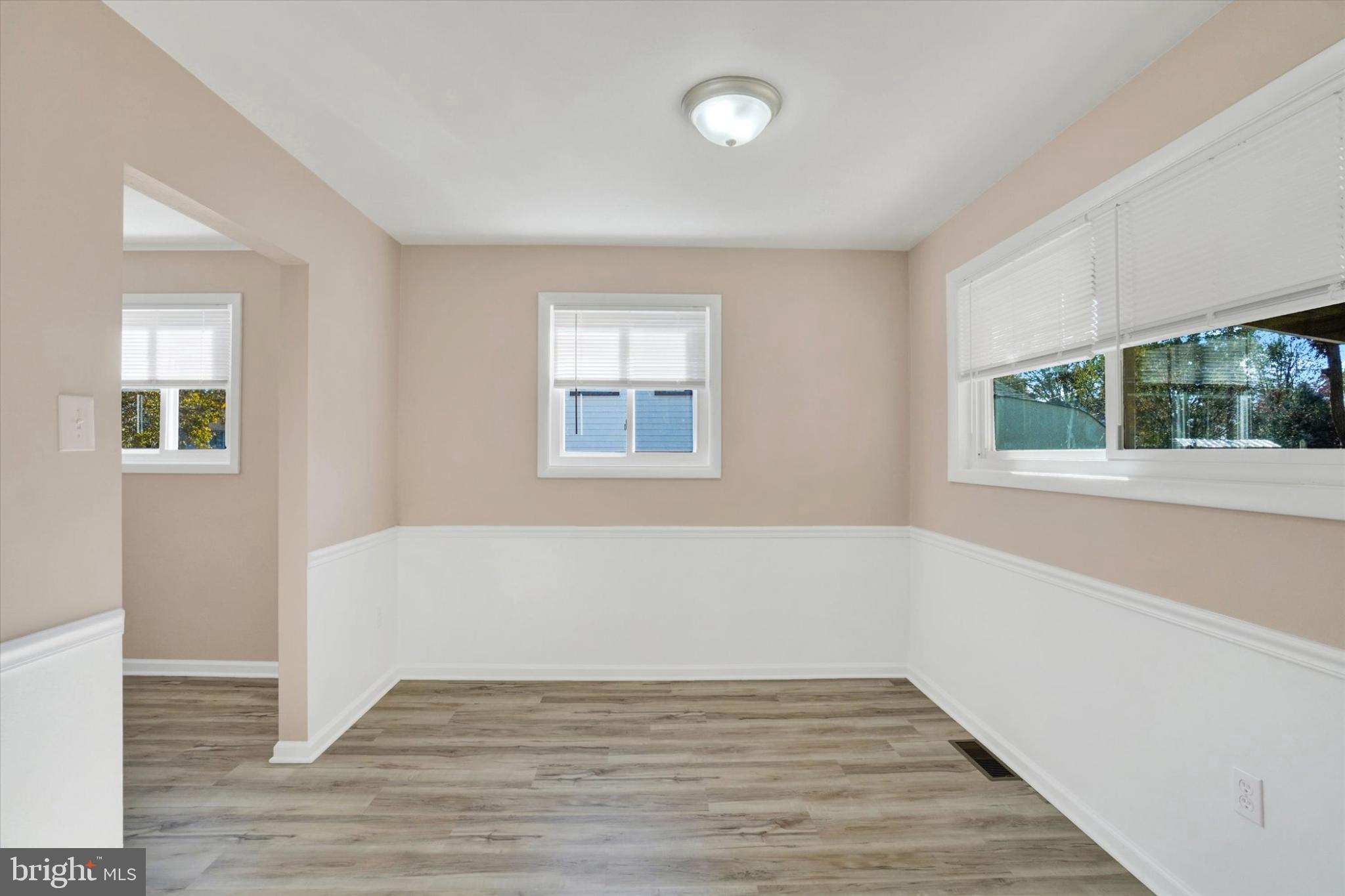 1212 Livingstone Road York, PA 17404 - Photo 10 of 24 a view of an empty room with wooden floor and a window