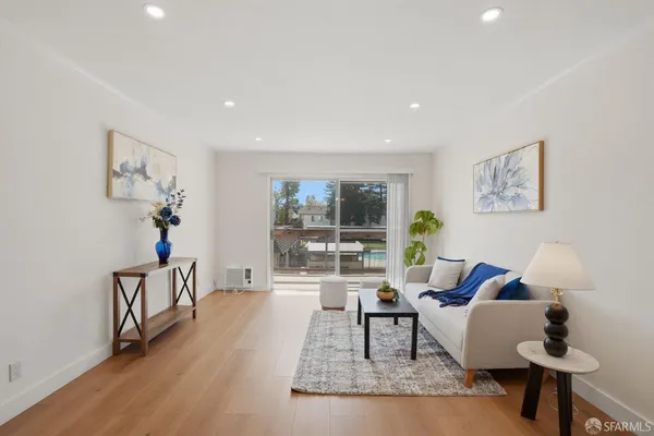 a living room with furniture and a table