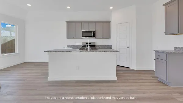 a kitchen with stainless steel appliances granite countertop a sink stove and wooden floor