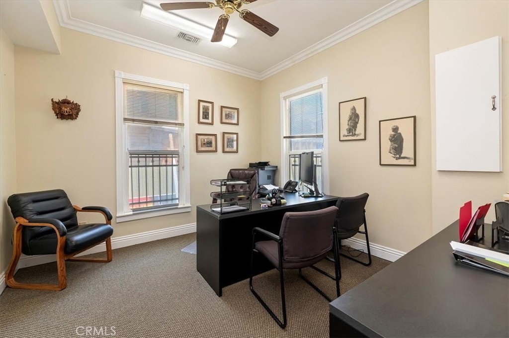 3845 Tenth Street Riverside, CA 92501 - Photo 17 of 45 a view of a workspace with furniture and a window
