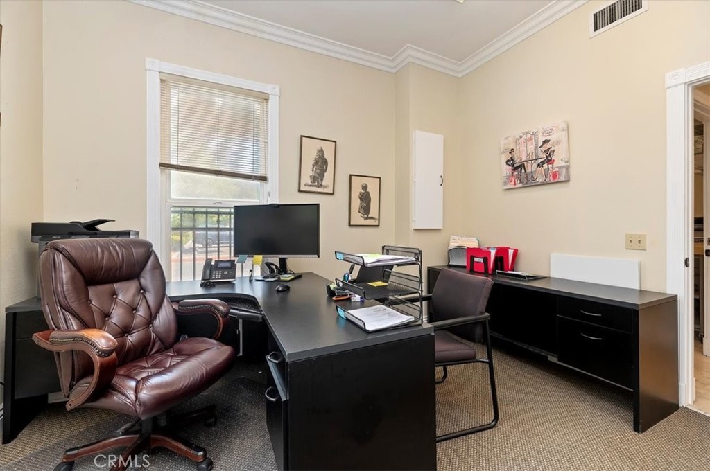 3845 Tenth Street Riverside, CA 92501 - Photo 18 of 45 a living room with furniture and a flat screen tv