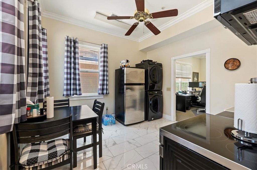 3845 Tenth Street Riverside, CA 92501 - Photo 21 of 45 a kitchen with a refrigerator and a sink