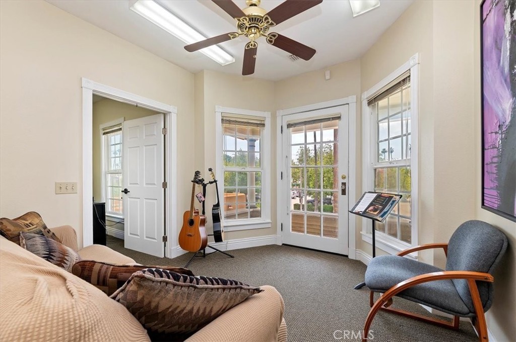 3845 Tenth Street Riverside, CA 92501 - Photo 27 of 45 a living room with furniture and two windows