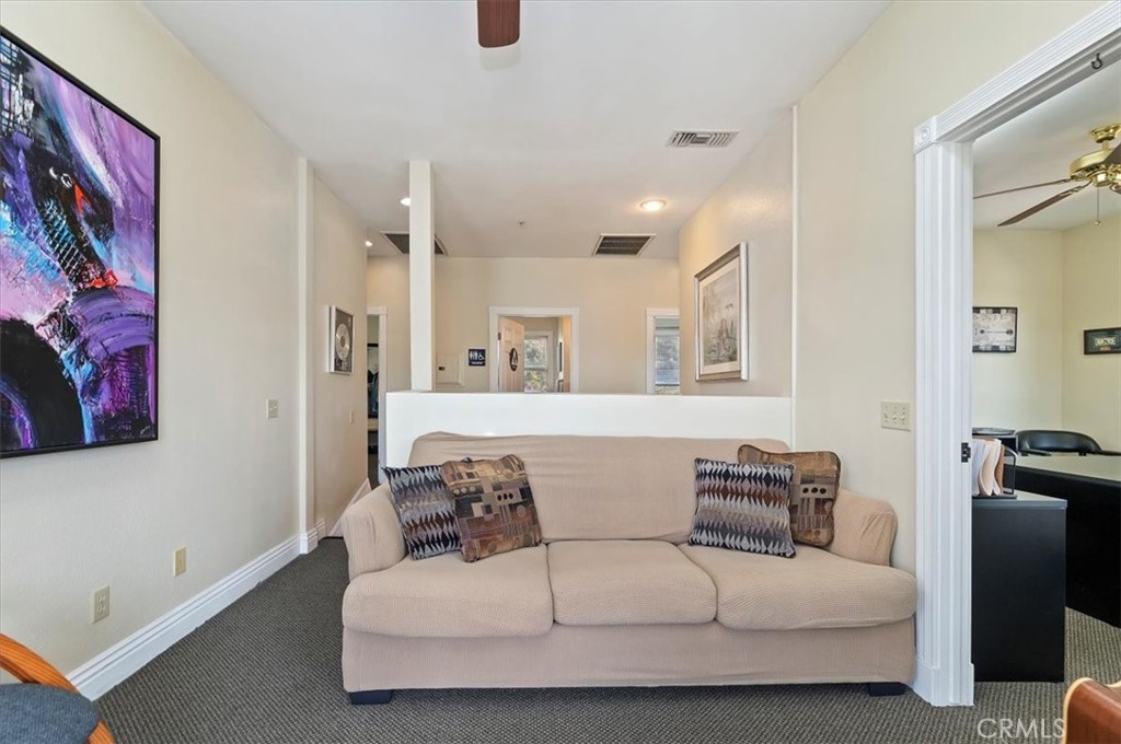 3845 Tenth Street Riverside, CA 92501 - Photo 28 of 45 a living room with furniture and a couch