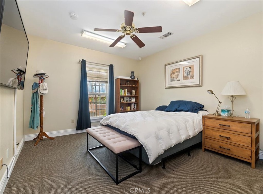 3845 Tenth Street Riverside, CA 92501 - Photo 30 of 45 a spacious bedroom with a bed and a dresser