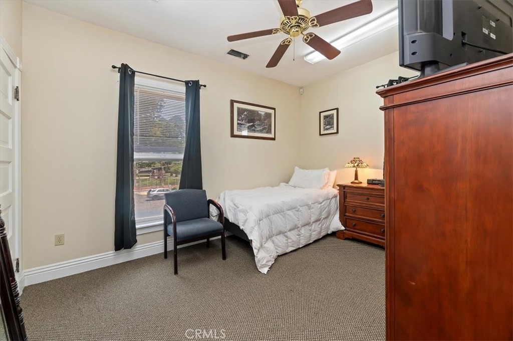 3845 Tenth Street Riverside, CA 92501 - Photo 34 of 45 a bedroom with a bed and a window