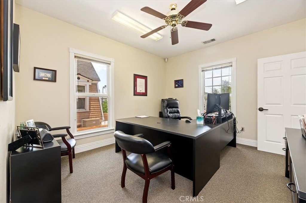 3845 Tenth Street Riverside, CA 92501 - Photo 35 of 45 a view of a workspace with furniture and a window