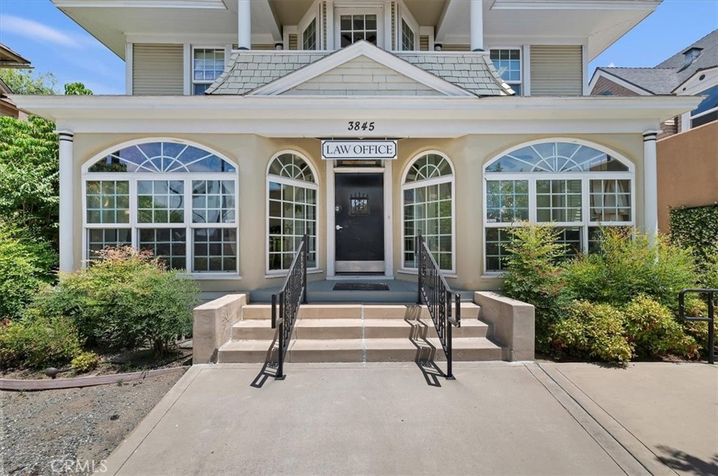 3845 Tenth Street Riverside, CA 92501 - Photo 6 of 45 a view of front door of house with outdoor seating space