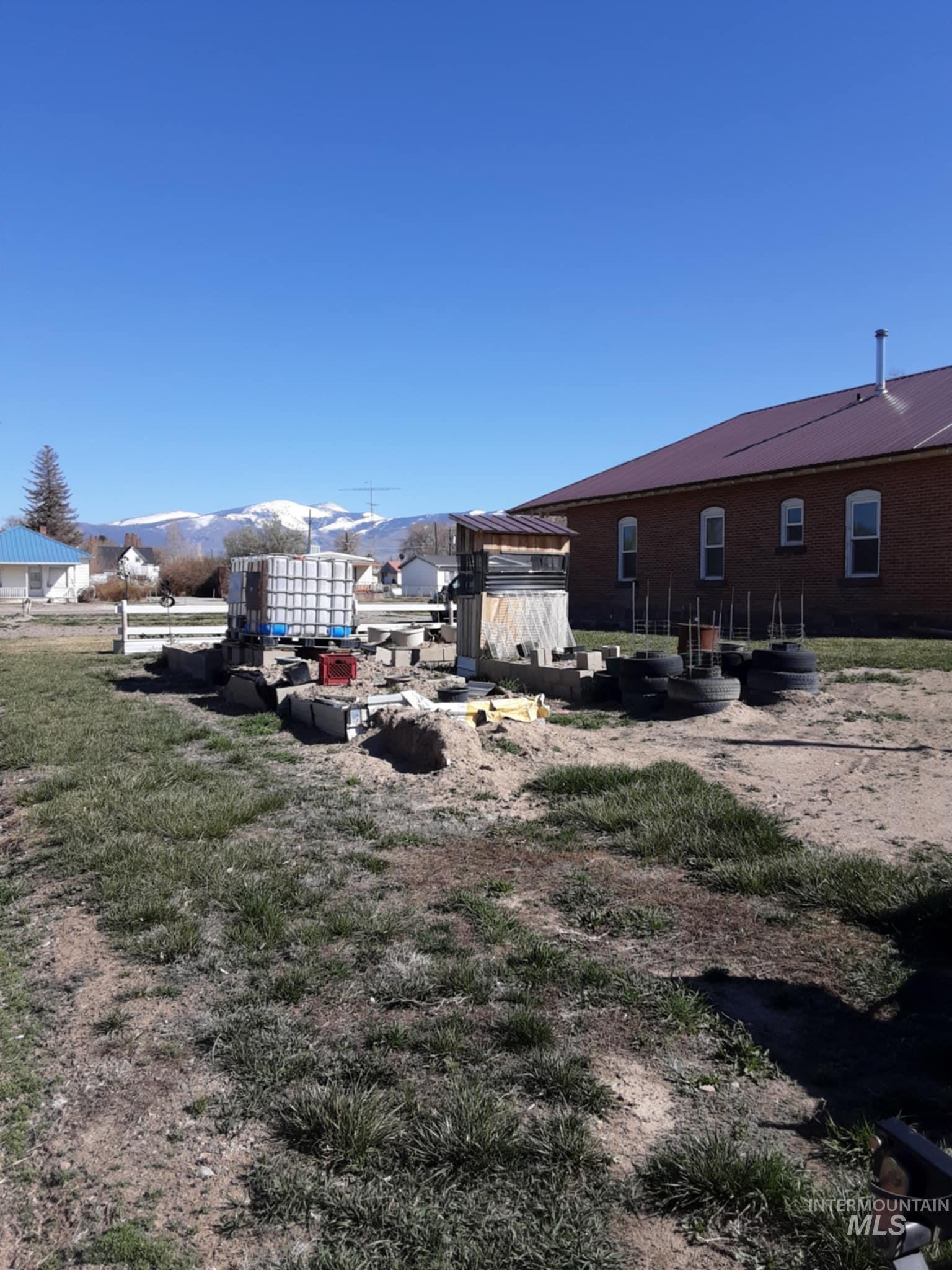145 North Lincoln Avenue Oakley, ID 83346 - Photo 41 of 48 View of yard with a gazebo and a mountain view