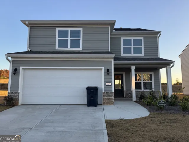 a front view of a house with yard