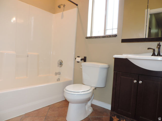 140 North 200 E Street Glenwood, UT 84730 - Photo 16 of 54 Full bath featuring vanity, dark tile patterned floors, and bathing tub / shower combination