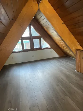 a bathroom with a granite countertop toilet sink and mirror