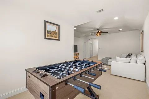 a living room with furniture and a table
