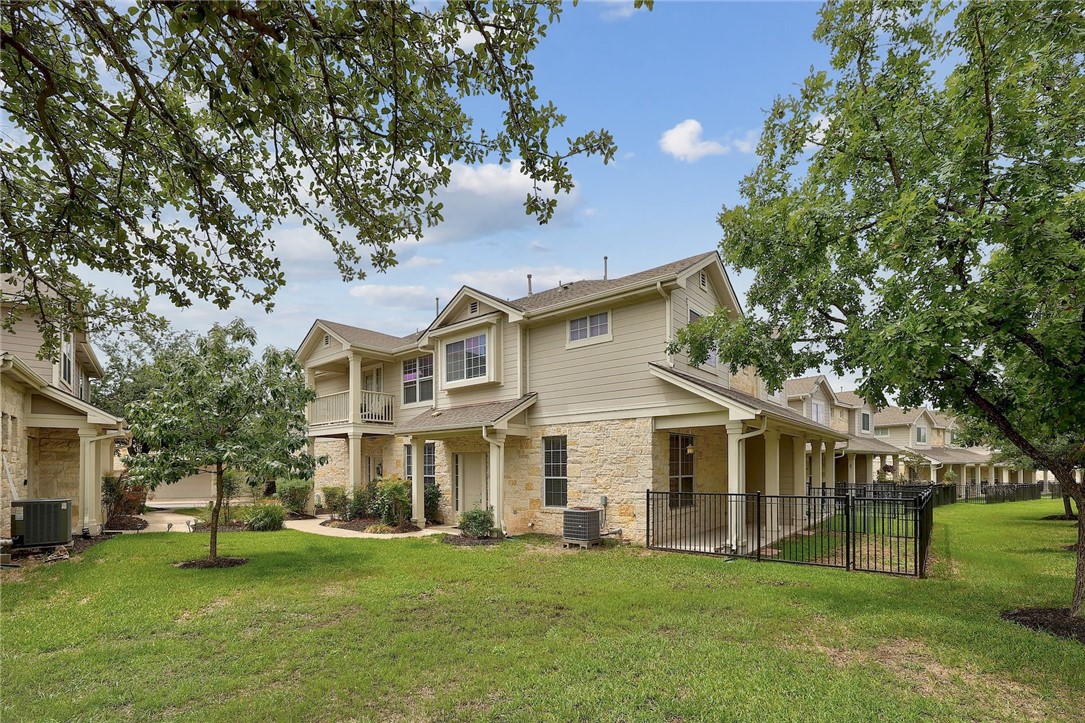 1900 Scofield Ridge Parkway, Unit 4603 Austin, TX 78727 - Photo 1 of 1 a front view of a house with a garden