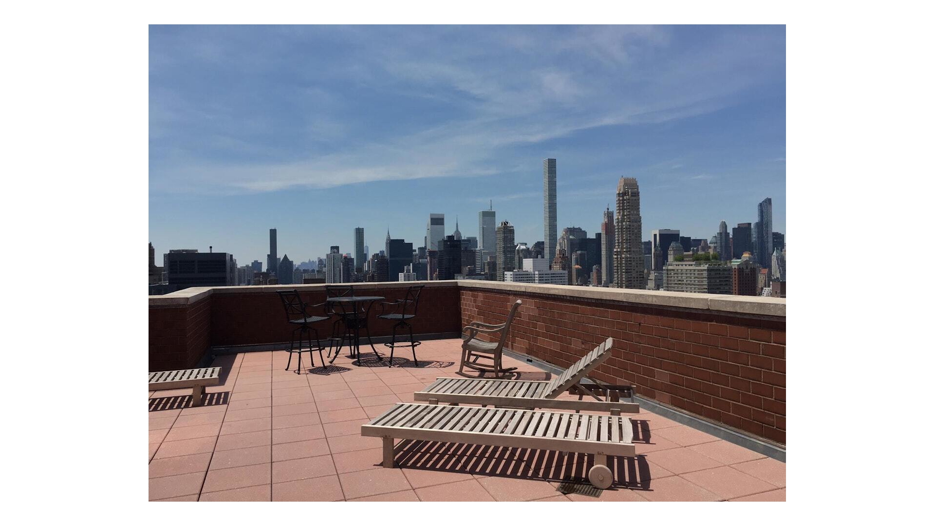 330 East 75th Street, Unit 28BC Manhattan, NY 10021 - Photo 15 of 17 a balcony with a couch
